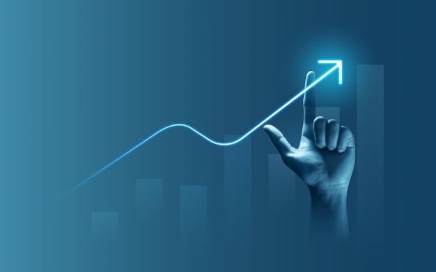entrepreneur drawing a bright arrow chart for monetary achievement